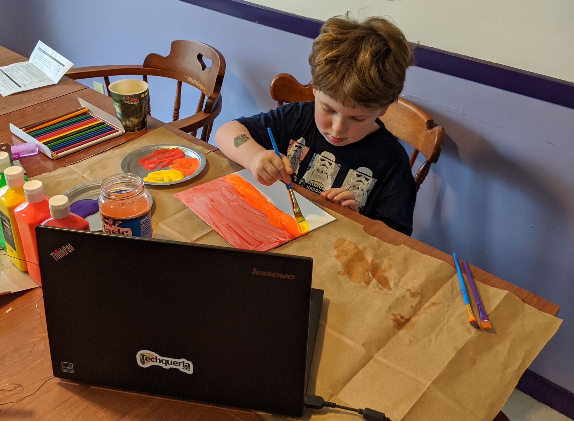 child-painting-at-table